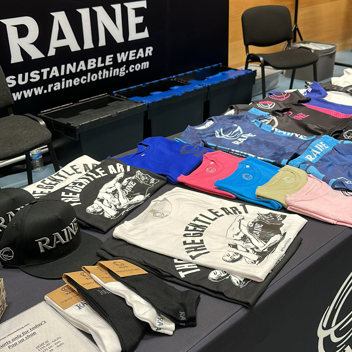 display of raine clothing at a jiu jitsu event