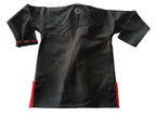 Back of a black competition gi with red lining on a white background
