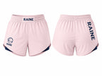 Front and back views of light pink athletic shorts with navy blue accents, featuring the word 'RAINE' printed on the waistband and down the left leg, with a circular logo on the right leg.