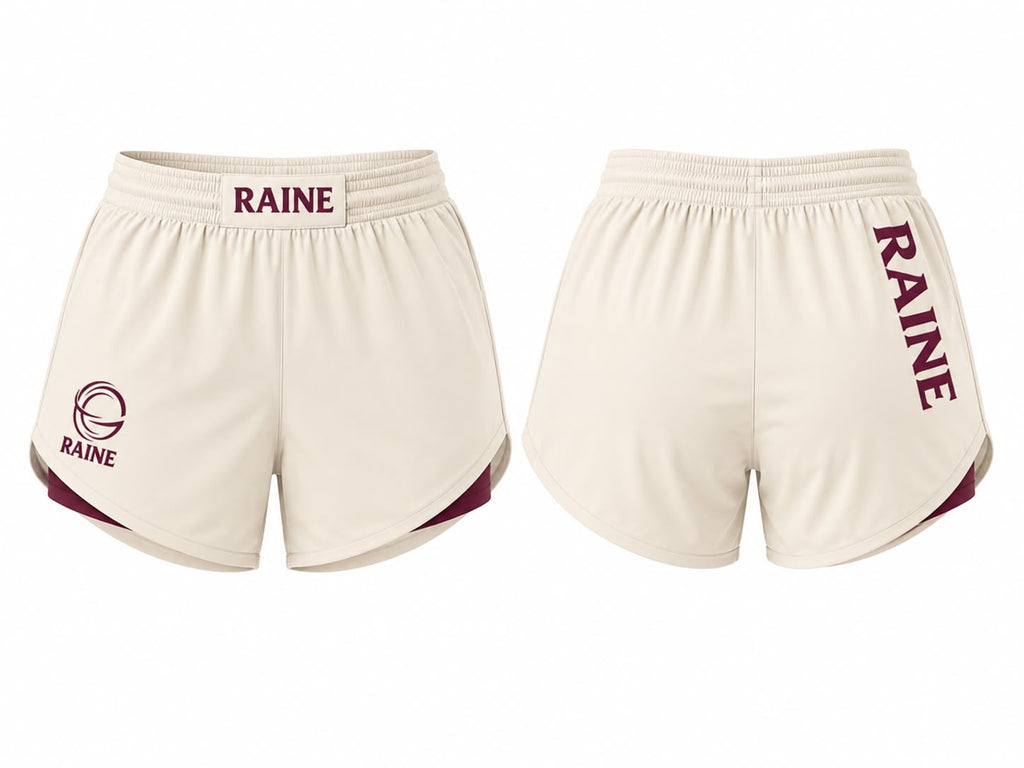 Front and back views of cream athletic shorts with maroon trim and 'RAINE' branding, displayed on a plain white background.