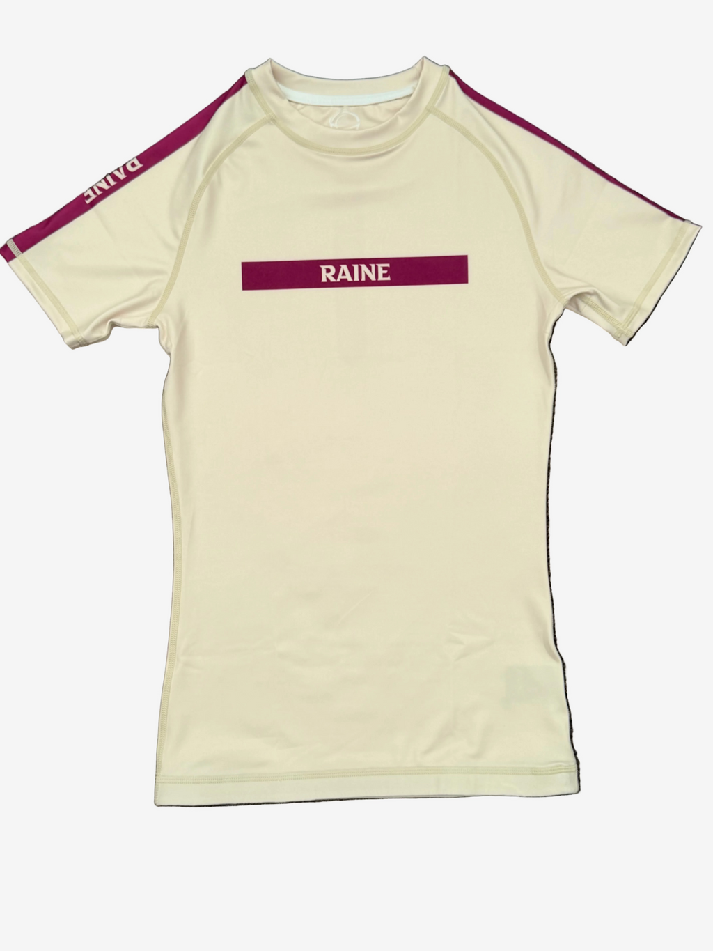 ivory rashguard with burgundy accents and 'RAINE' branding