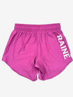 burgundy shorts with 'RAINE' branding 
