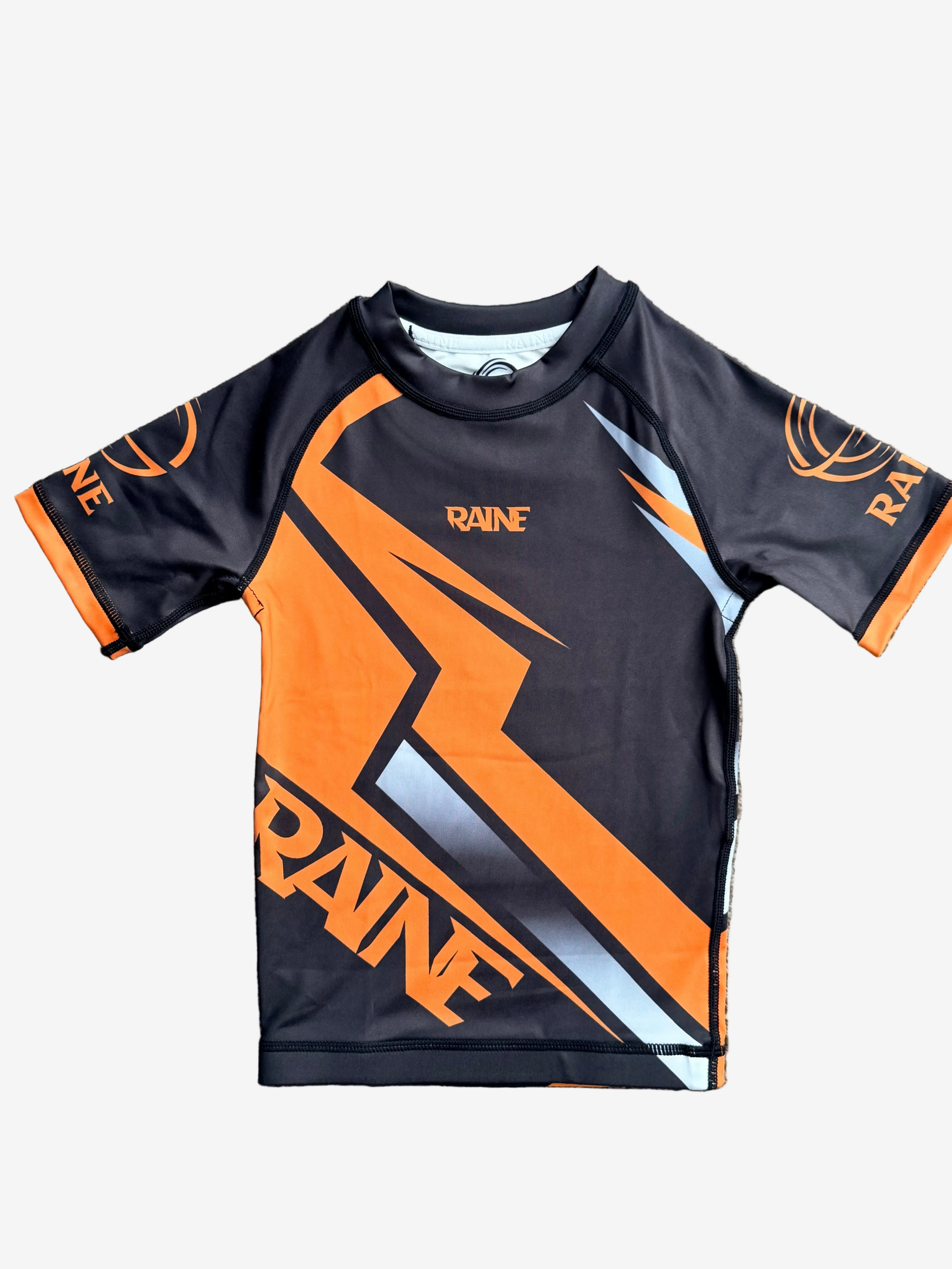 Black and orange Rash Guard with 'Raine' branding 