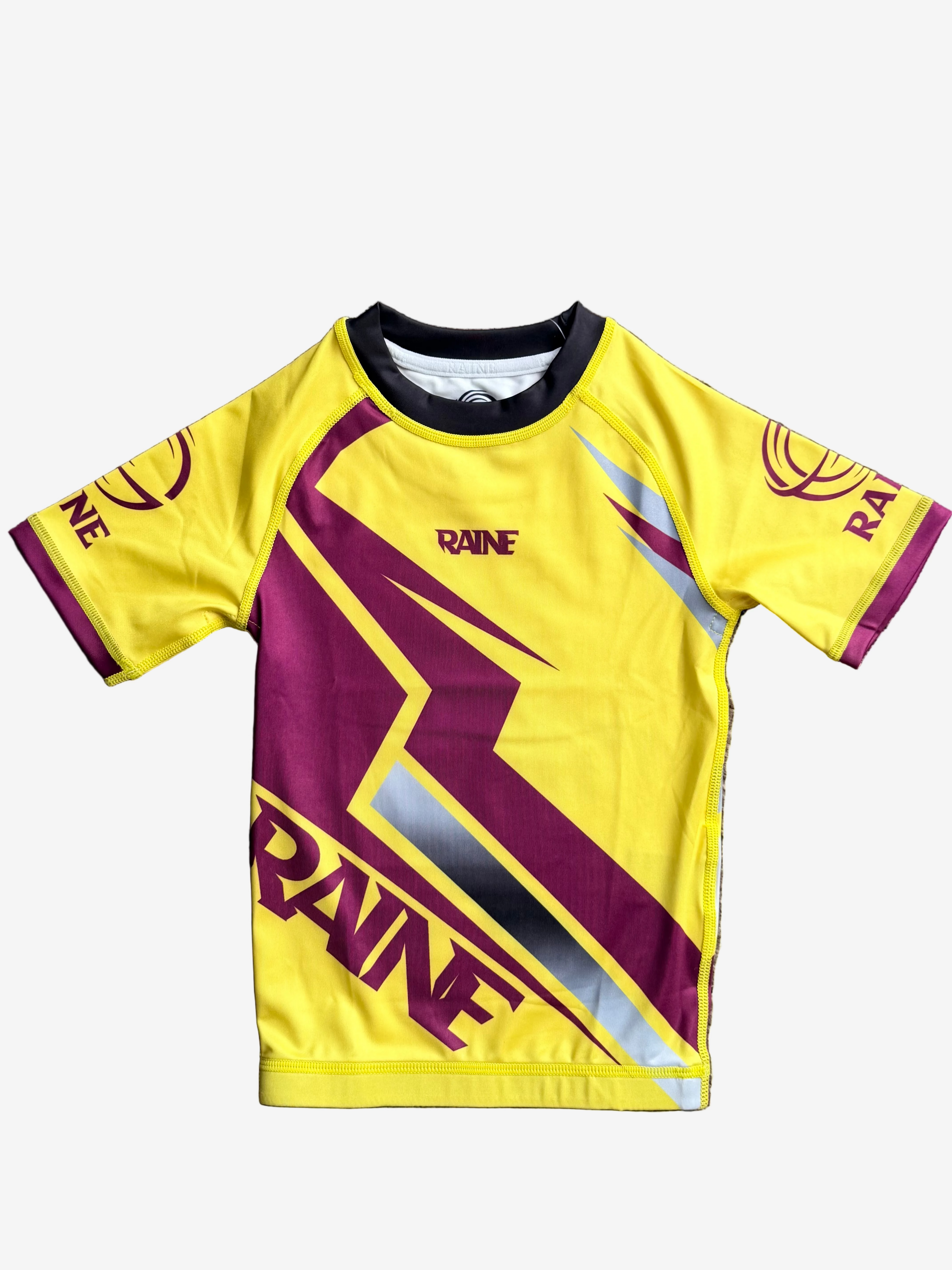 Yellow and deep red rashguard with 'RAINE' branding 